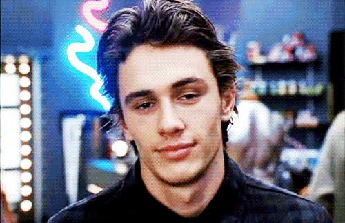 James Franco baring teeth in a smile. 